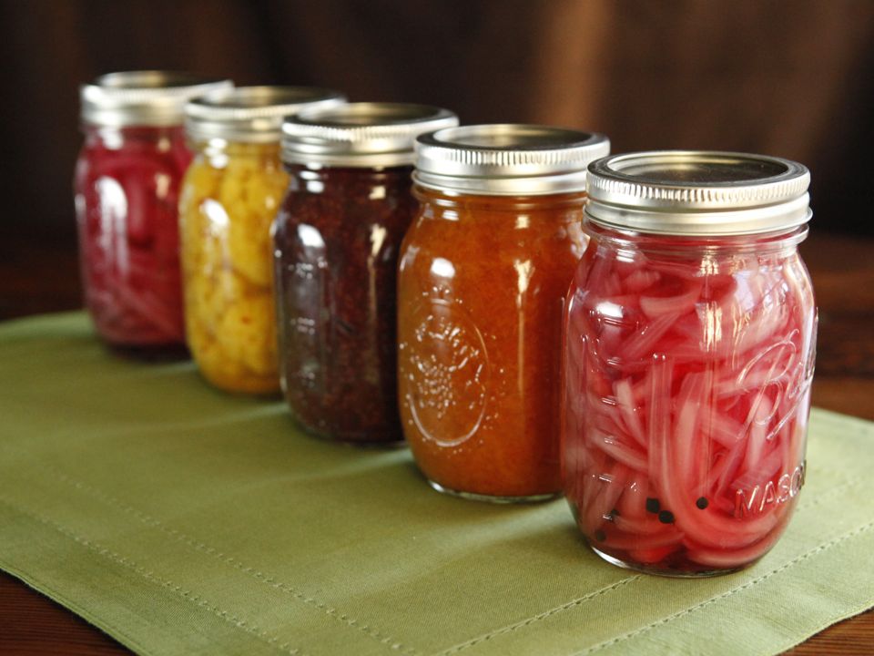 Various fruits and vegetables being canned